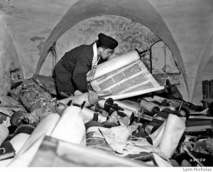 A U.S. Army chaplain sorts through stolen Torah scrolls after the war in this photograph by Lynn Nicholas, author of "The Rape of Europa," the seminal study of cultural destruction during World War II. Source: Lynn Nicholas.