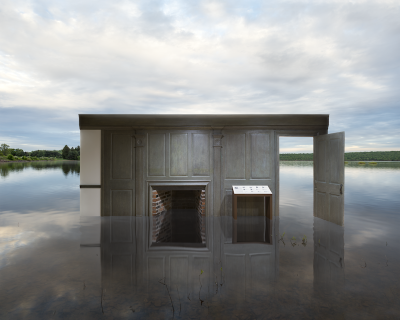 a wood paneled room half submerged in water 