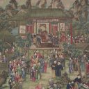 Segment of painted wallpaper including Chinese structures on stilts, with a crowd of people in the front of the painting, and mountains in the background.