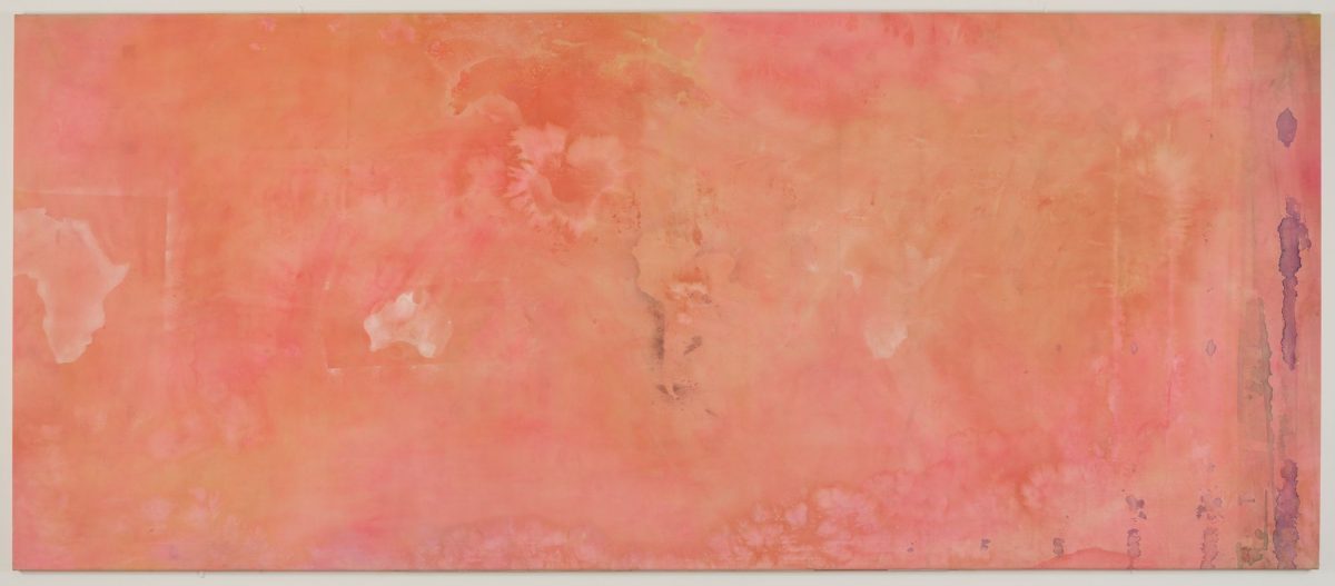 Orange, pink, and purple paint overlaying the indistinct shapes of continents such as Africa, Australia, and North America.