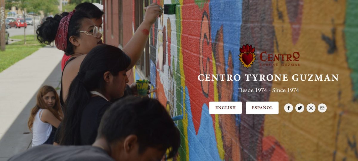 The homepage of Centro Tyrone Guzman's website. It shows a picture of people painting a mural, and the option to select Spanish or English language versions of their website.