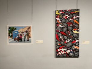 Two artworks from Mia's Staff Art Show hanging on the gallery wall