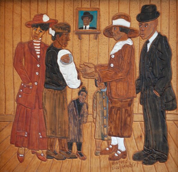 Two families are facing each other, with the intent of one giving their newborn child to the other family. This was dyed on leather.