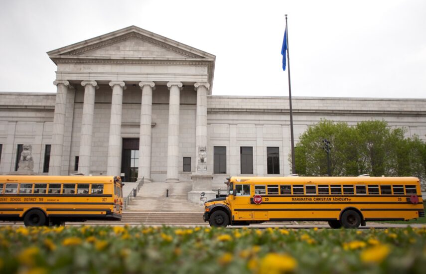 Two school buses are parked in front of the Third Avenue entrances of the museum.