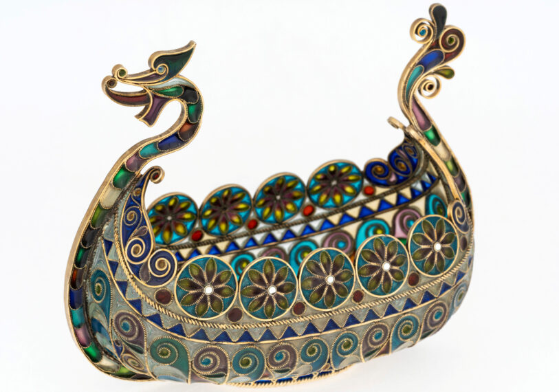 small silver and enamel sculpture of a Viking dragon boat