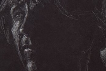 Black-and-white sketch of a woman's face drawn on black paper with white pencil