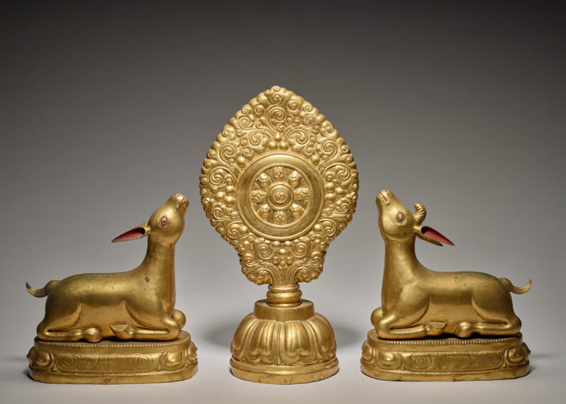 Gold statues of Wheel of the Law with Deer