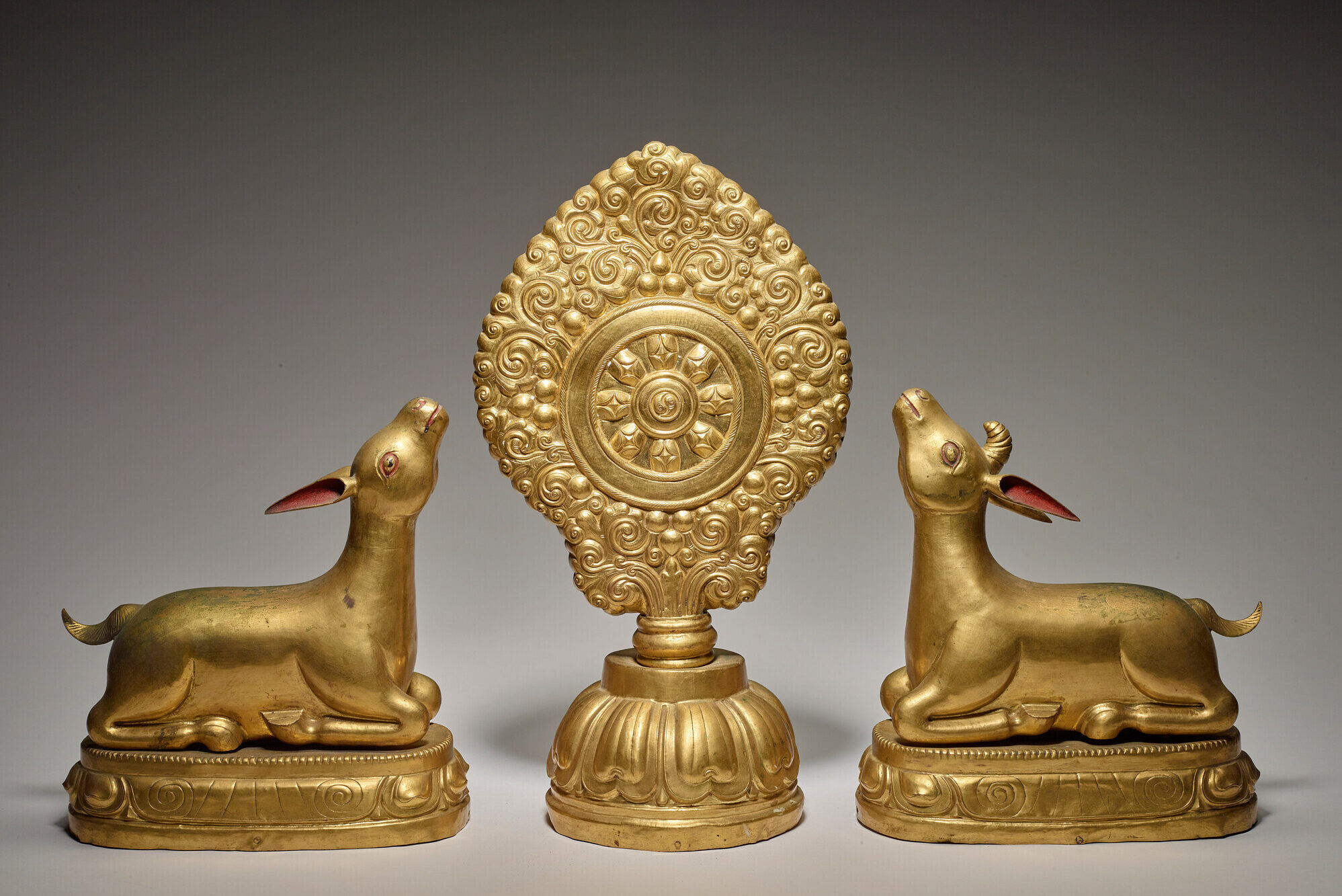 Gold statues of Wheel of the Law with Deer