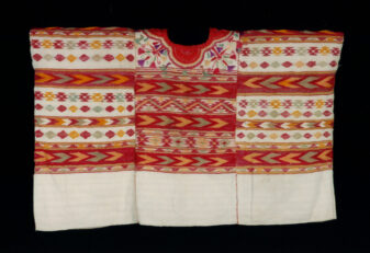 Guatemala woman's ceremonial blouse, or huipil, featuring white, red and orange colors