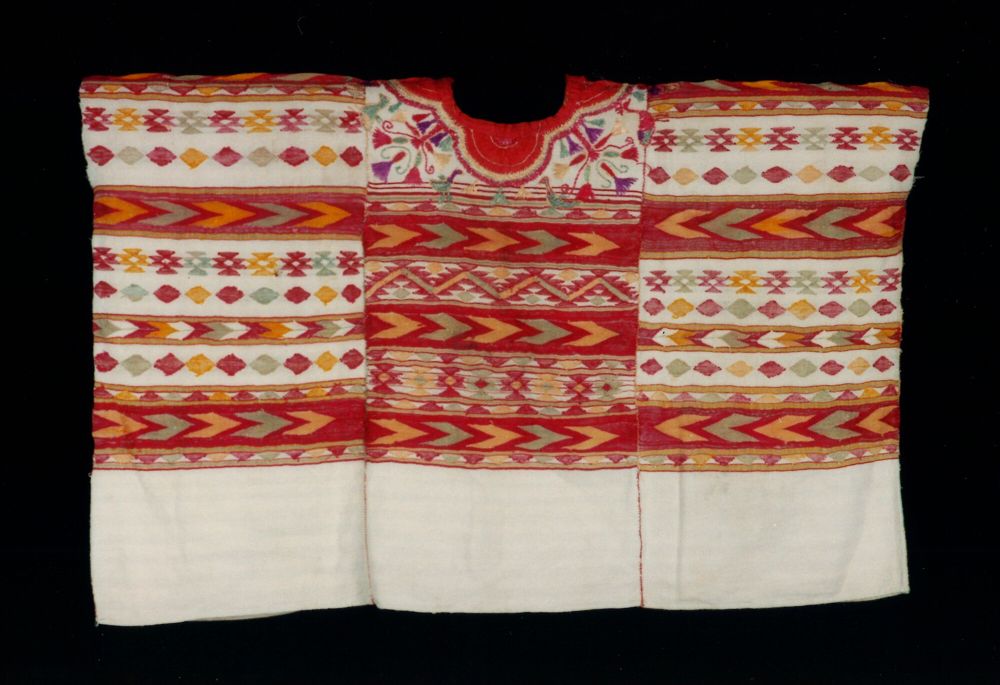 Guatemala woman's ceremonial blouse, or huipil, featuring white, red and orange colors