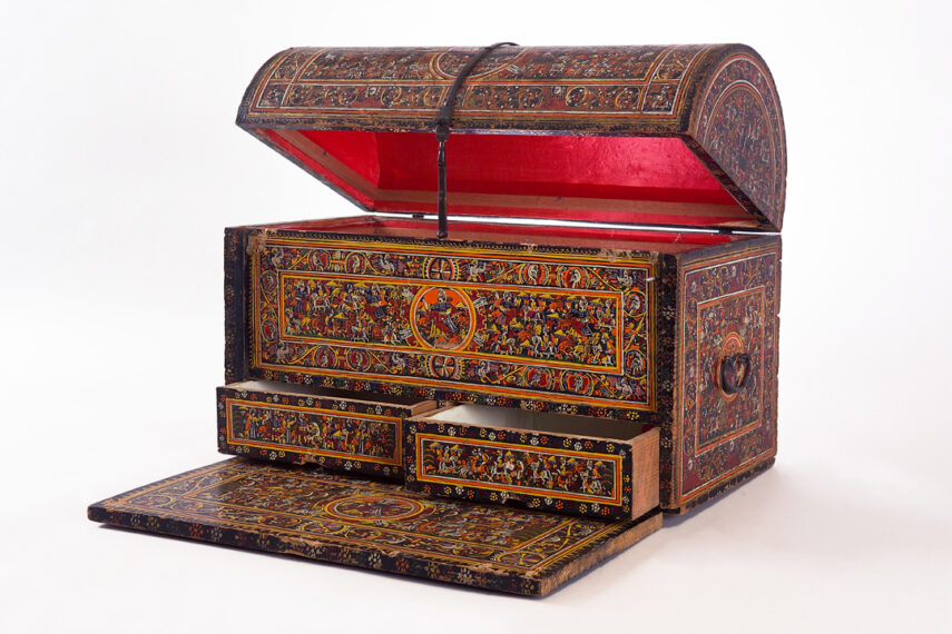 Bufetillo with small metal handles on the side and a domed lid displayed slightly ajar, bottom drawers open, and writing top at the base pulled out