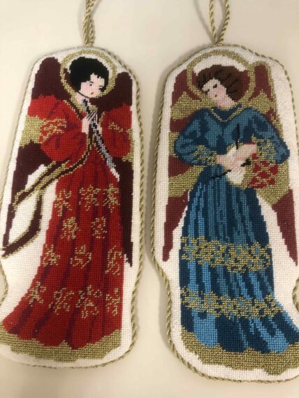 needlepoint ornament of two angels, one in blue robes and one in red robes