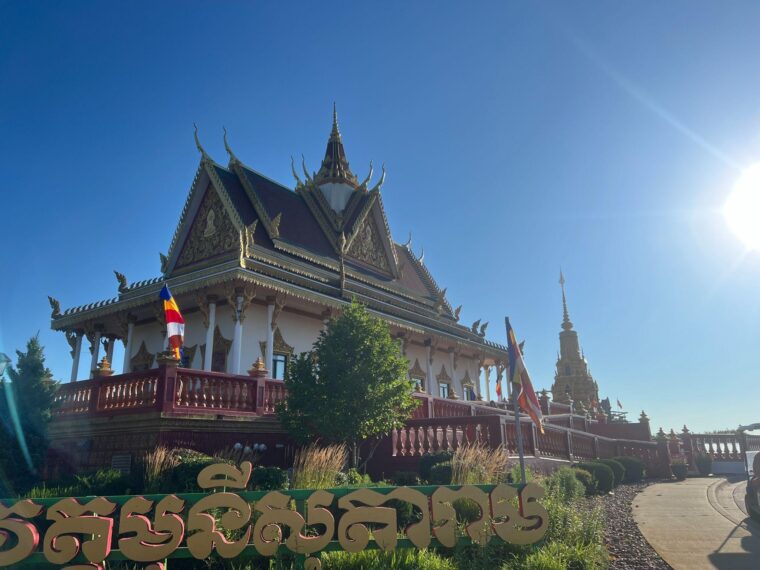 photo of a Cambodian Buddhist temple in Minnesota set against a cloudless blue sky