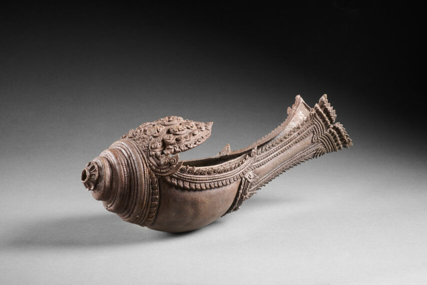 image of a copper ritual instrument in the shape of a conch