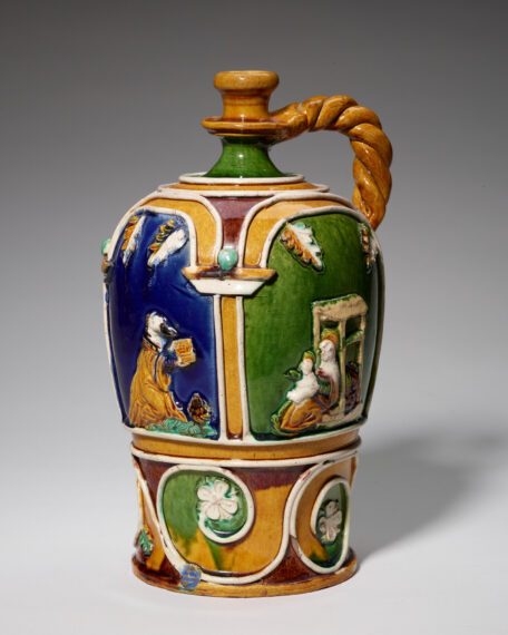 Decorative ceramic jug with colorful panels and figurative scenes