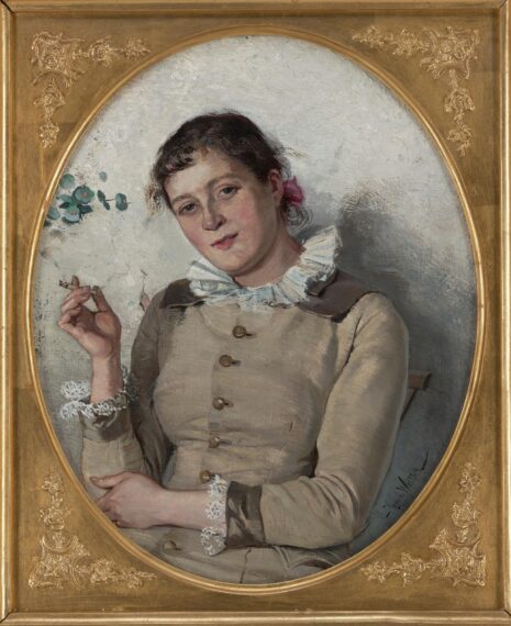 Painting of a woman wearing a beige dress with dark trim and lace cuffs, featuring buttons along the front. Her hair is dark and pulled back, with a pink ribbon visible. She is holding a cigarette in her right hand, which is raised near shoulder level. 