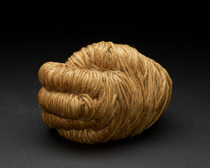 A sculpture made of hemp fiber shaped into a clenched fist