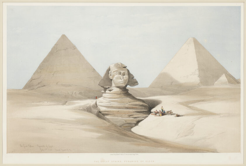 The image depicts the Great Sphinx of Giza situated in a vast desert landscape with two large pyramids in the background. The Sphinx, a large limestone statue with the body of a lion and a human face, is central in the image. It appears partially buried in sand. Behind the Sphinx, to the left and right, stand two pyramids with smooth, sloping sides that converge at a point at the top. 