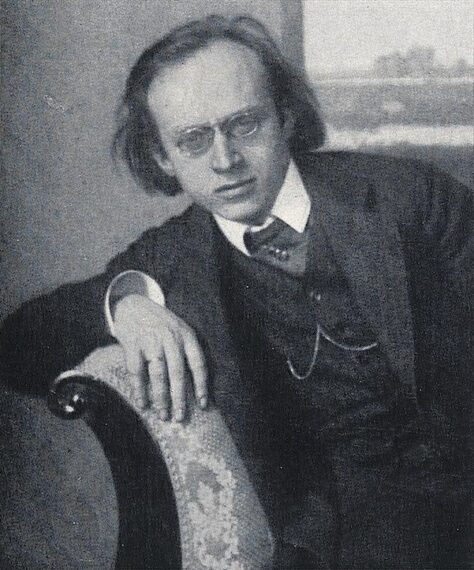 black-and-white photo of Herwarth Walden wearing a suit and leaning on the arm on a sofa