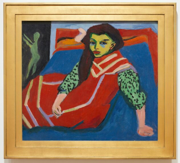Painting of a person with yellow-green skin lounging on a couch. The individual is wearing a polka-dotted green garment and is draped in a red blanket with cream and orange detailing.
