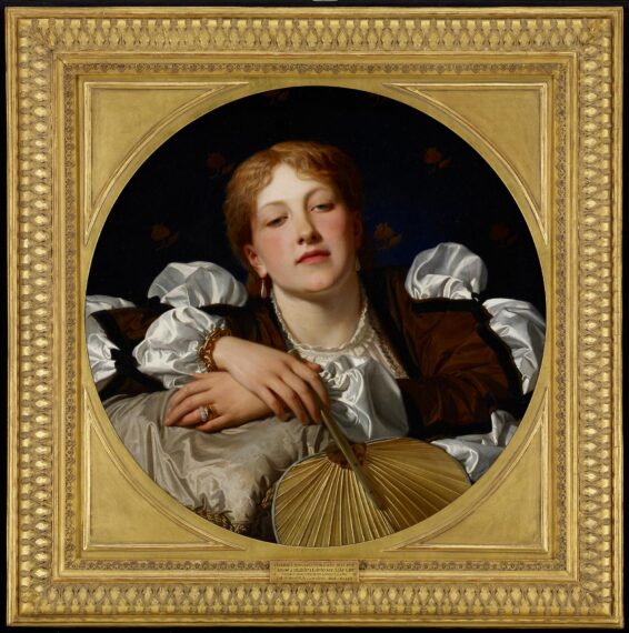 Classical painting of a person with reddish-brown hair, wearing a white blouse with puffed sleeves and a dark over garment. The individual is depicted in a pose leaning over a pillow, holding a fan in one hand. The background is dark with faint floral patterns. The painting is housed in an ornate gold circular frame with intricate detailing.