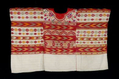 Guatemala woman's ceremonial blouse, or huipil, featuring white, red and orange colors