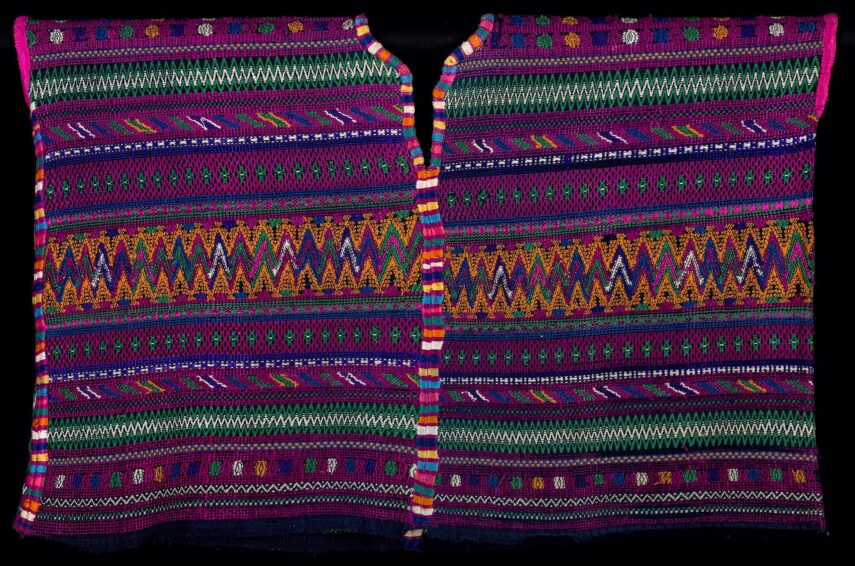 Colorful woven textile with intricate patterns.