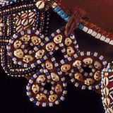 Intricate beadwork with blue, white, and brown beads.
