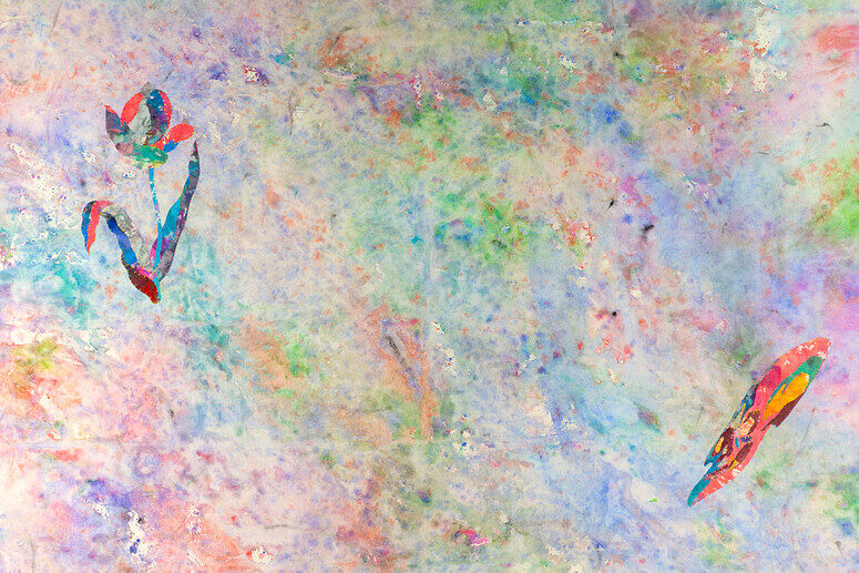 The image is an abstract painting with a multicolored design. On the left side, there is a flower-like shape with petal forms in red, green, and blue hues, along with a thin stem-like shape. To the right, a similar colorful shape with a curved, leaf-like appearance is visible. The background is a blend of pastel colors, predominantly in shades of blue, pink, orange, and green.