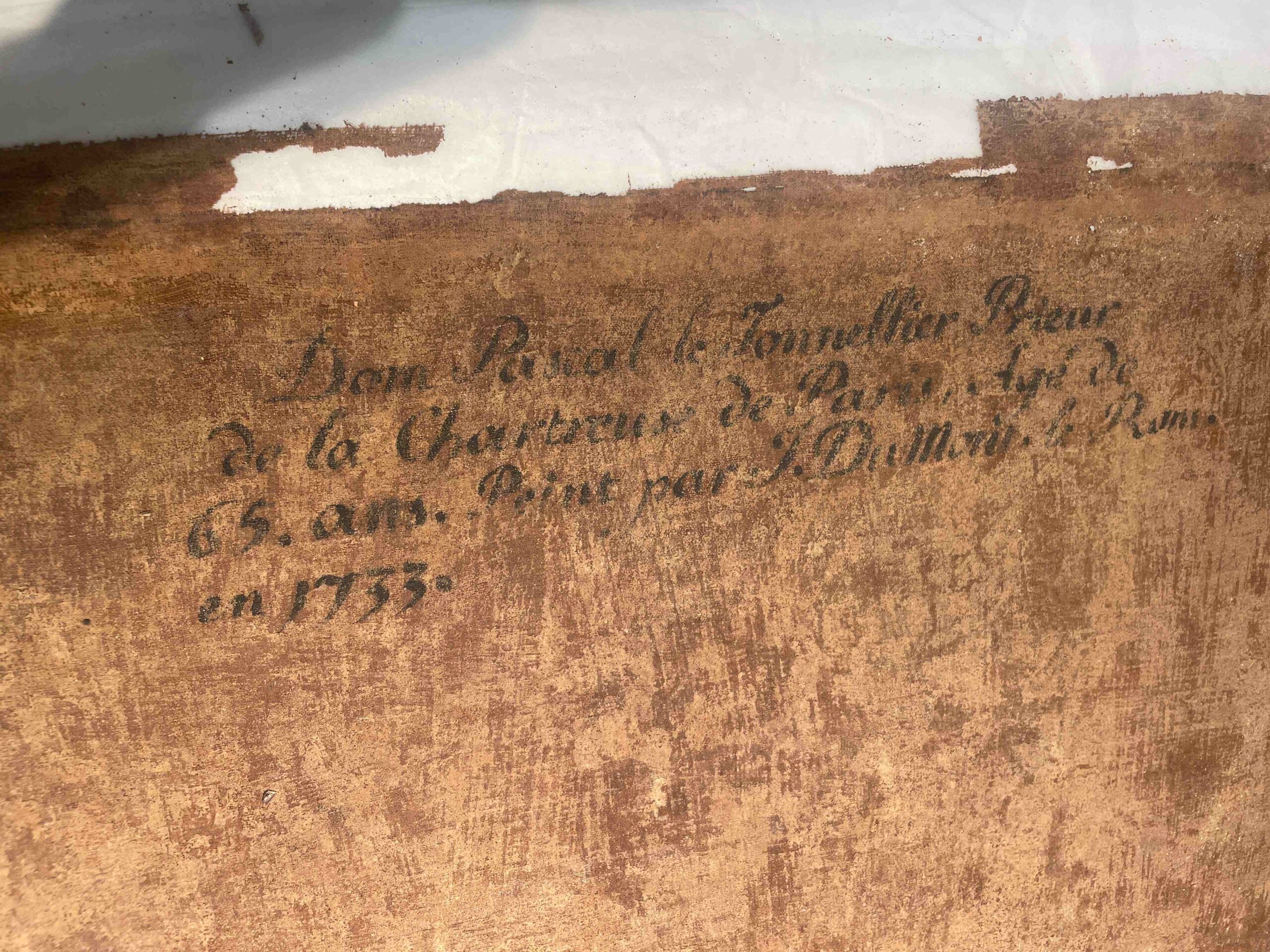 Worn brown canvas with faded handwriting.