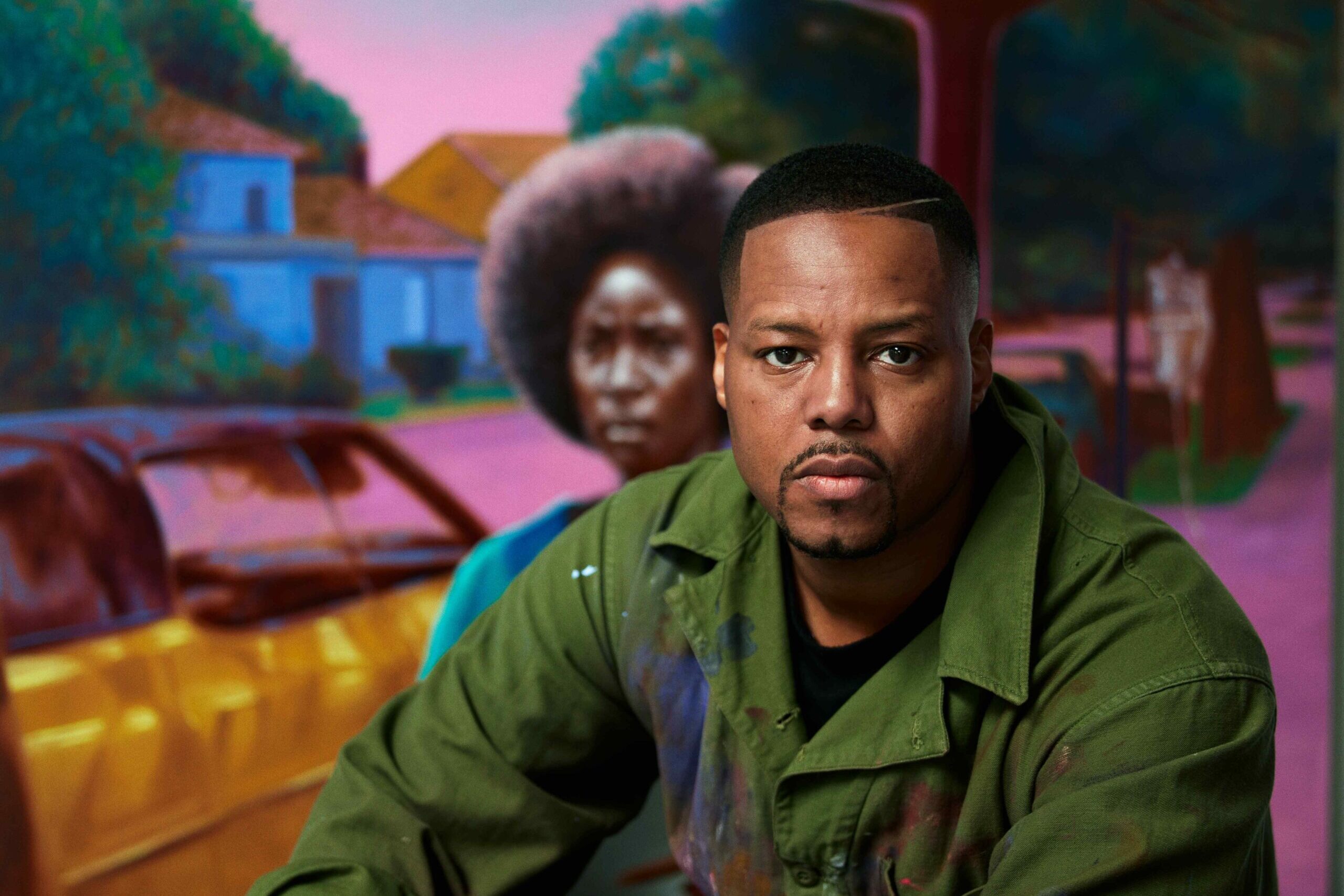 Headshot of Titus Kaphar in front of a painting