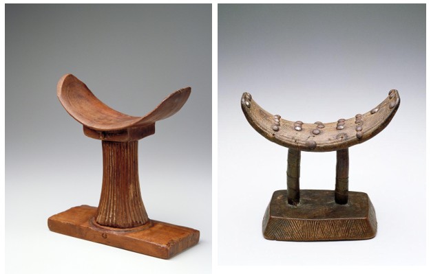 Two wooden headrests with curved tops and bases.