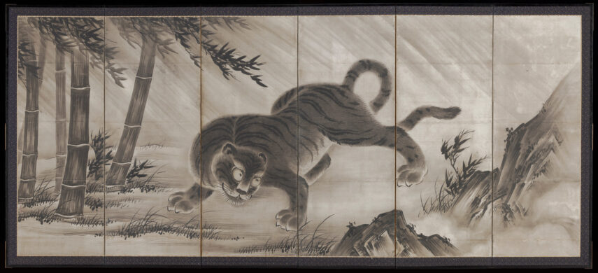 Image shows a tiger among bamboo and mountains.