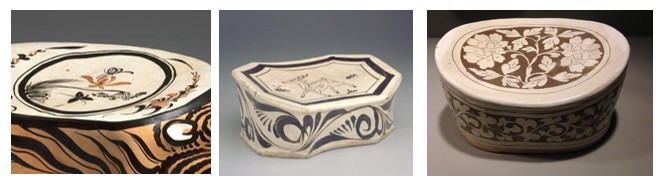 Three decorative ceramic boxes with various patterns.