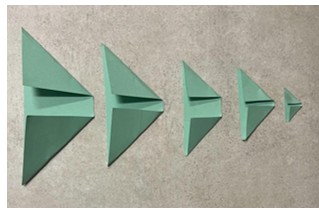 Photo of green paper rectangles folded into a trapezoid shape