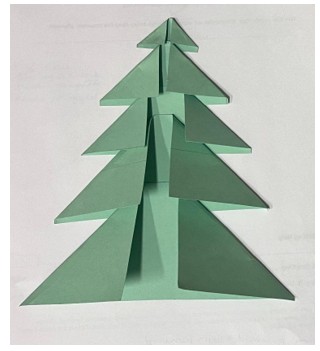 Photo of green paper rhombuses glued together to form a tree