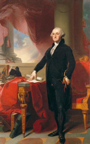 The image shows a man dressed in a black coat, white shirt, and black breeches standing to the right of a table. The table is covered with a rich red curtain-like cloth and several objects, including books, papers, and a quill pen.