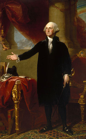 The image shows a man standing in a full-length portrait wearing formal, historical clothing, consisting of a dark coat and white cravat. The man stands beside an ornate table draped with a red cloth, on top of which rests a large book, a quill, and an inkwell. Behind him, there is a large chair with gold detailing.