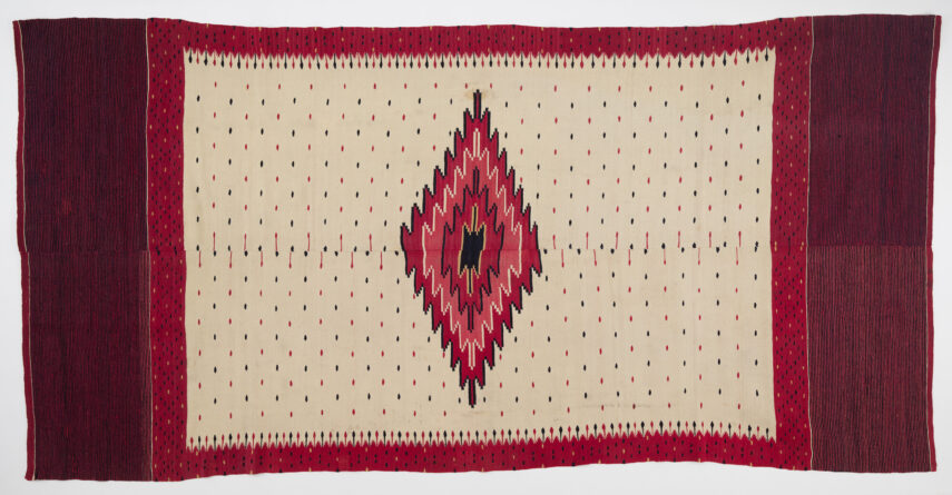 Textile with diamond pattern and red, black, and white colors