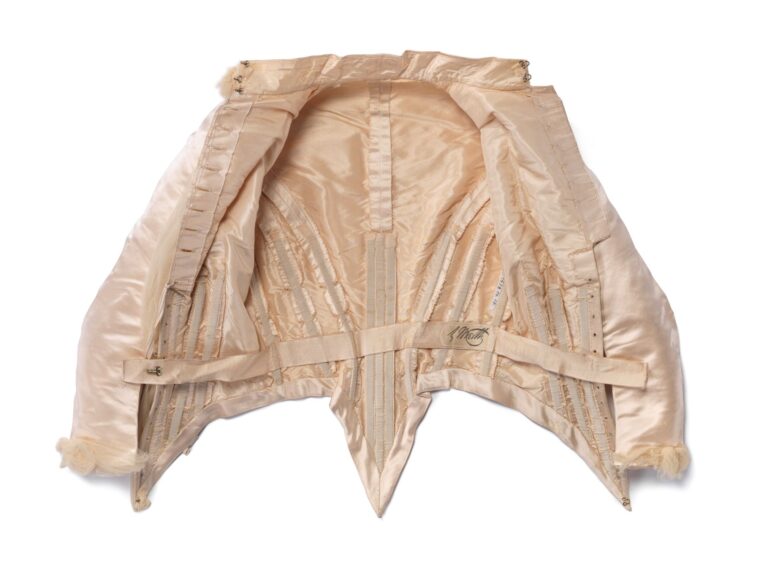 Inside view of a vintage corset with intricate stitching.