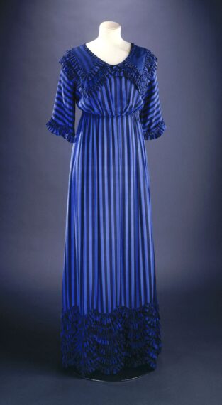 Blue striped dress with ruffled edges on a mannequin.
